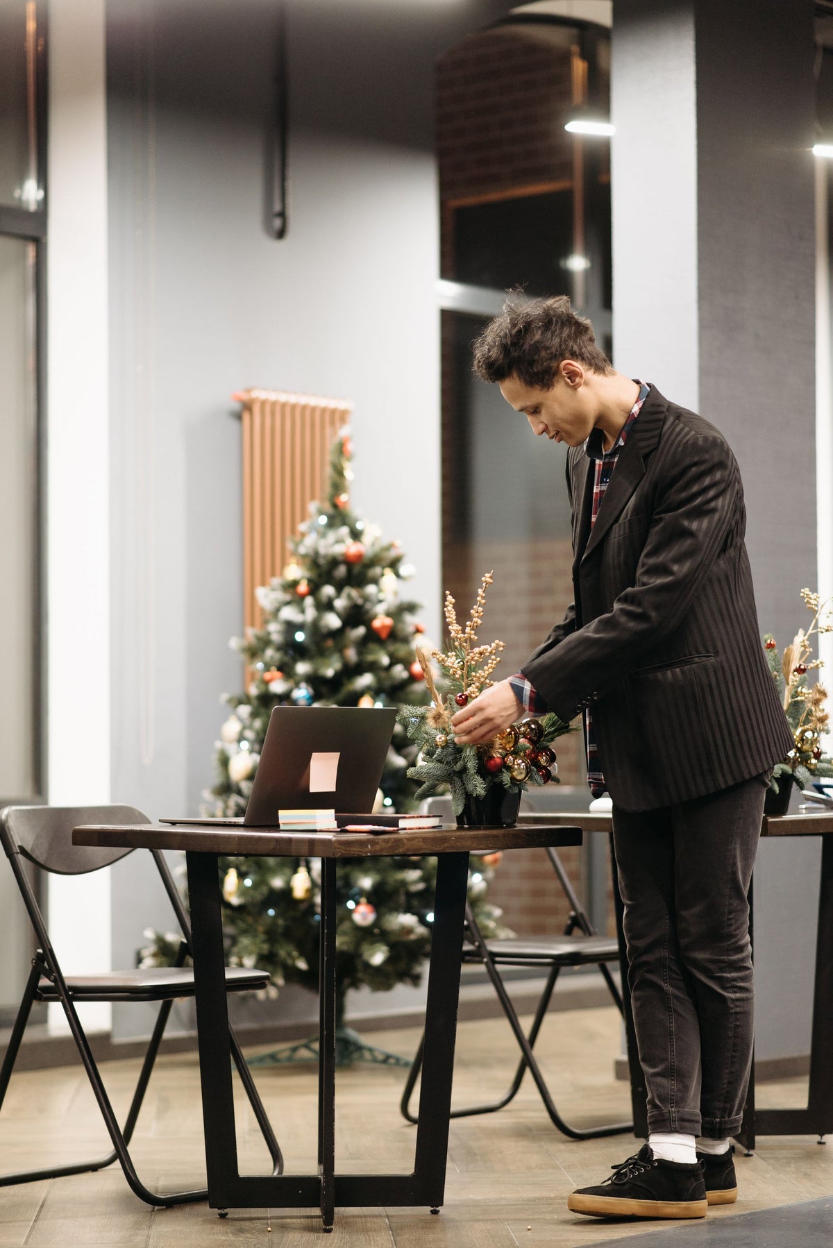 A florist placing an arrangement in a modern office
